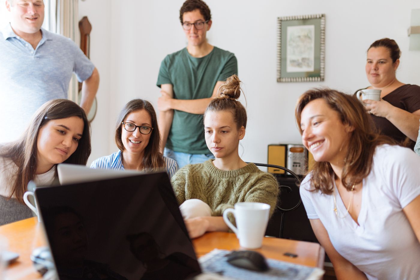 A small group learning together around a laptop
