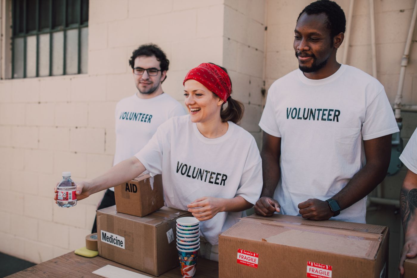 Volunteers handing out aid and supplies